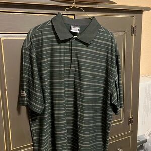 Black Nike golf shirt with Toyota financial services on right sleeve